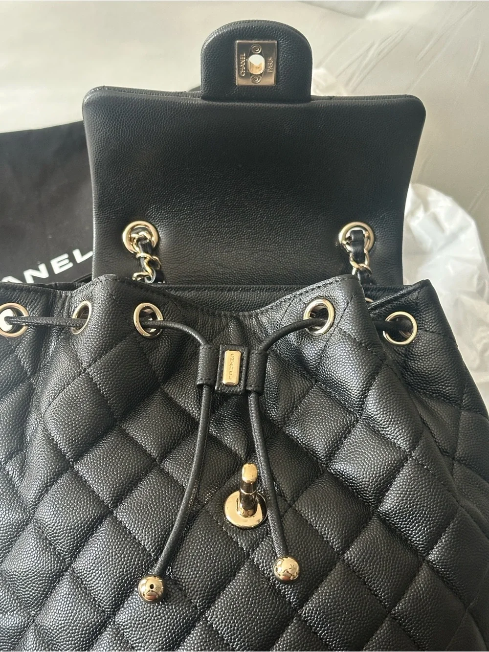 CHANEL Black Quilted Leather Drawstring Backpack with Gold CC